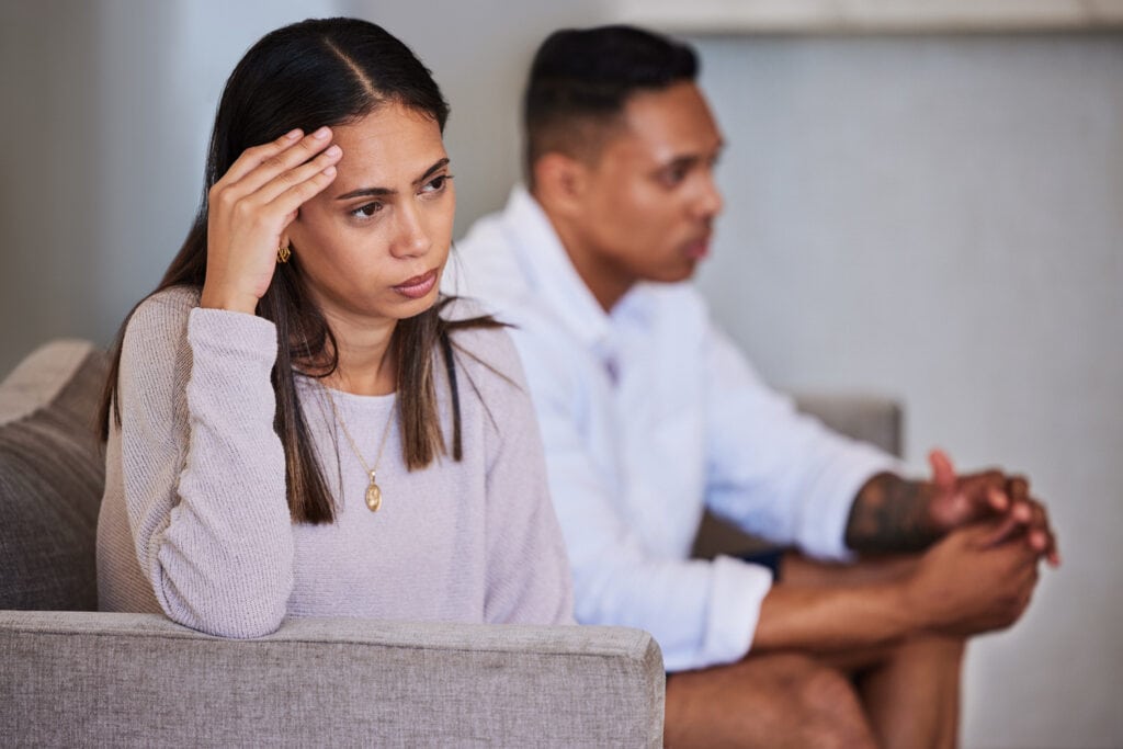 Divorce, sad and fight with couple on sofa with marriage problems feeling frustrated