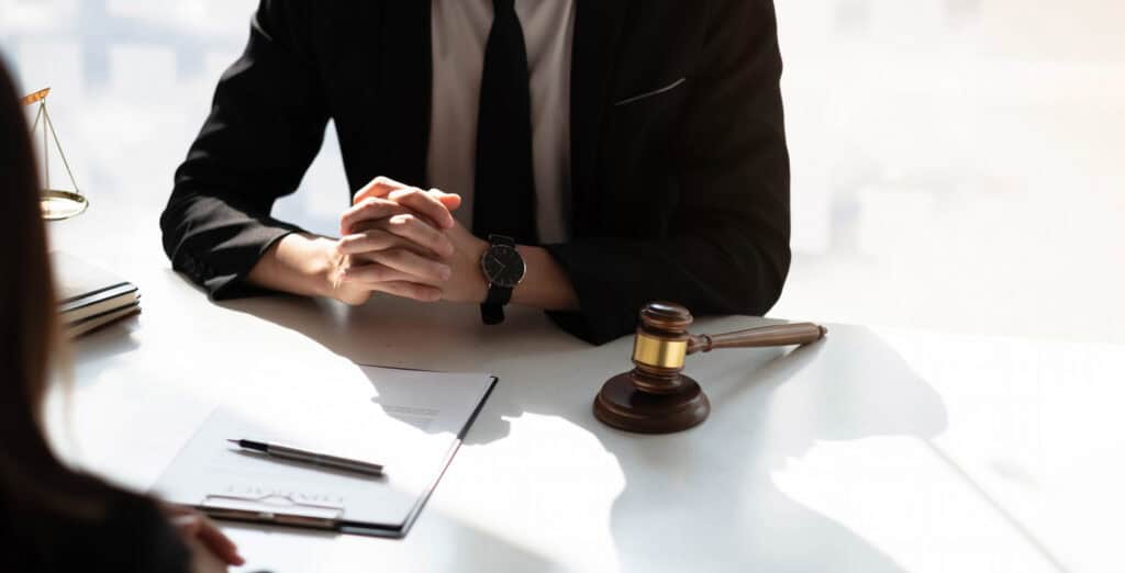 Business lawyer working about legal legislation in courtroom to help their customer